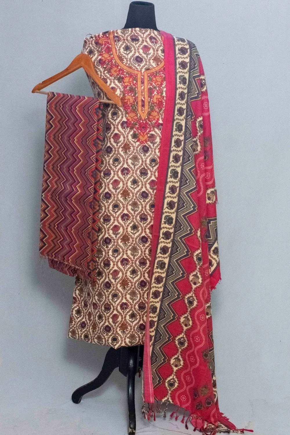 Cream Colour Woolen Kani Printed Suit With Neck And Over All Magical Print Provide Elegance.